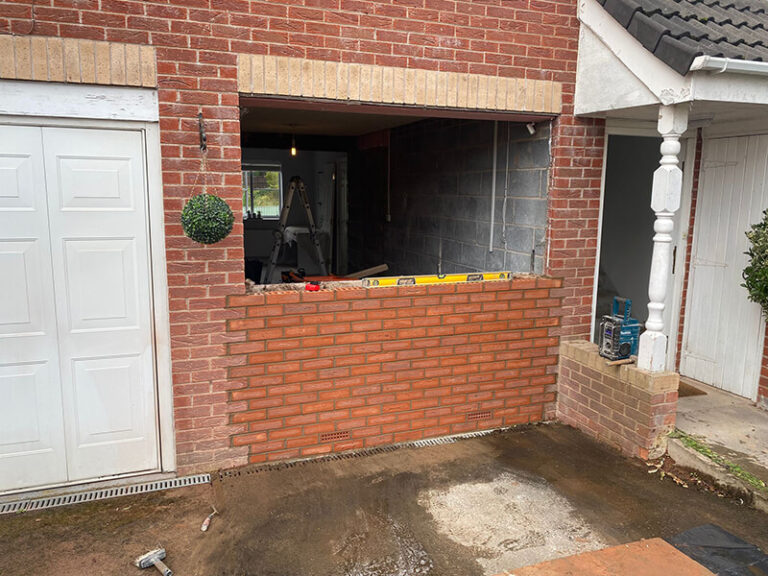 Garage conversion foundations: slab, walls and door infill
